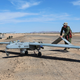 Marines prep an RQ-7Bv2 Shadow unmanned aerial system for launch. Source: Lance Cpl. Harley Robinson via The United States Marine Corps.